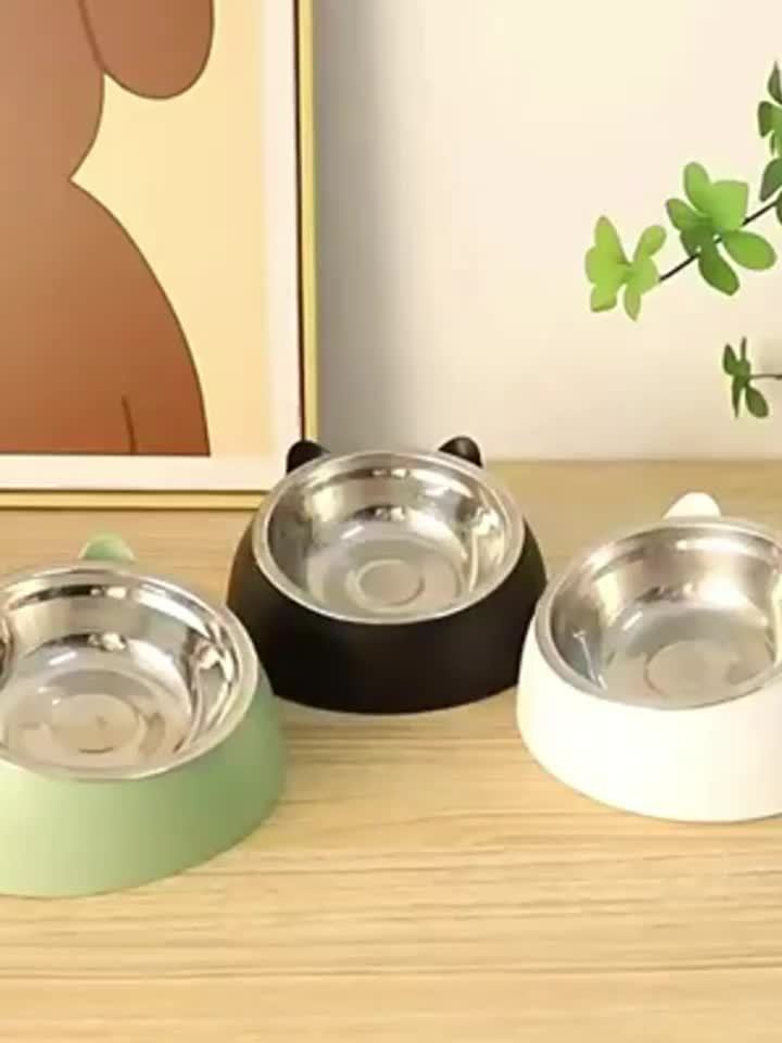 Tigela para gatos em aço inoxidável com suporte, apresentando um adorável design de orelhas, projetada para proteger a coluna cervical com sua bacia inclinada para água e comida.