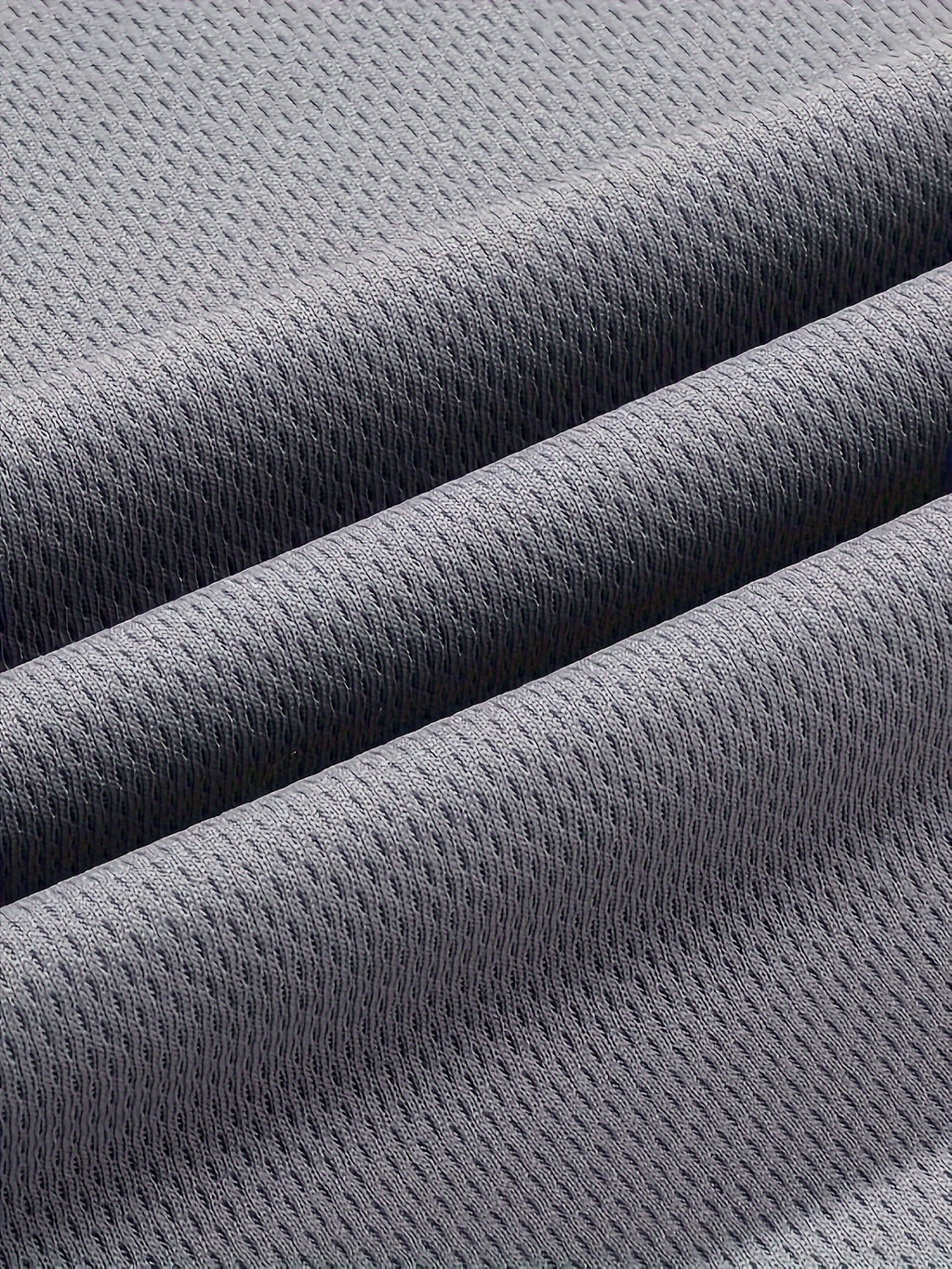 Camiseta regata masculina lisa, de secagem rápida, levemente elástica, com gola redonda e sem mangas. Ideal para academia, treinos e exercícios físicos.